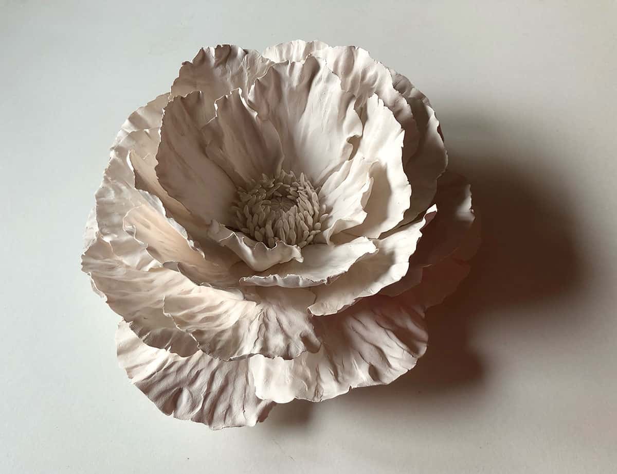 Ceramic Poppy created by Owen Mann $750. wall/tabletop sculpture