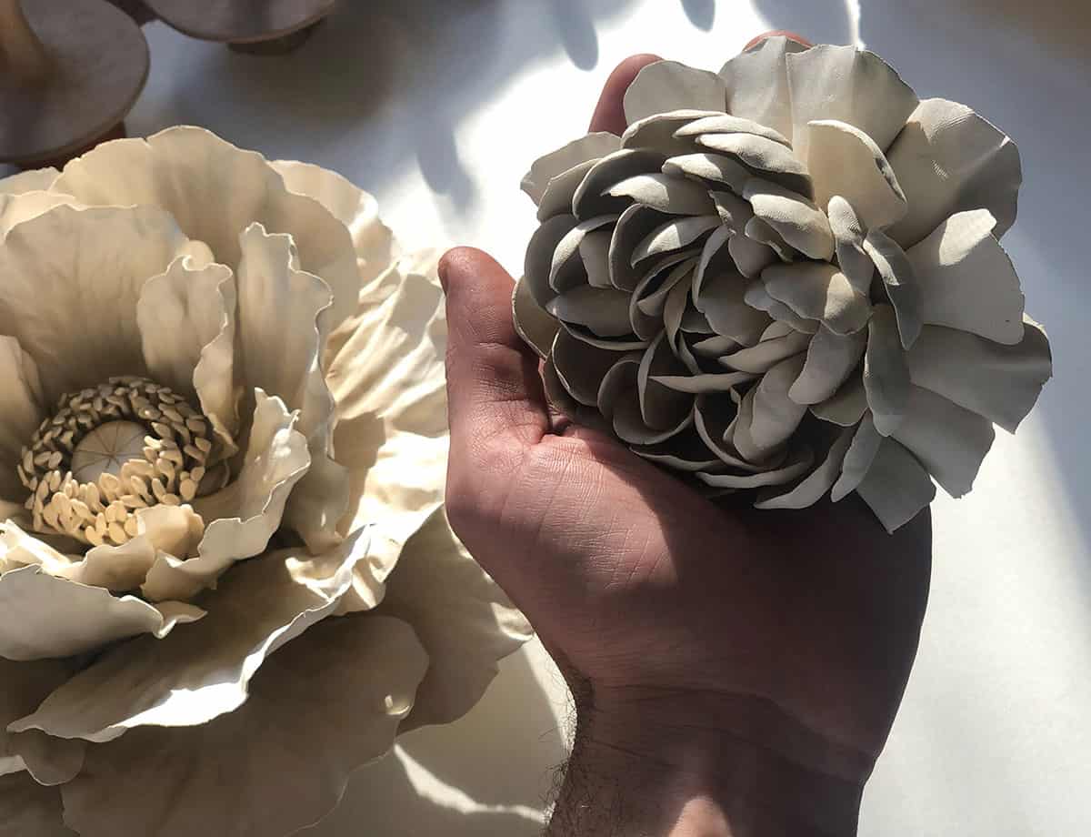 Ceramic flowers created by Owen Mann (Left: Poppy $250. / Right: Peony $140.)