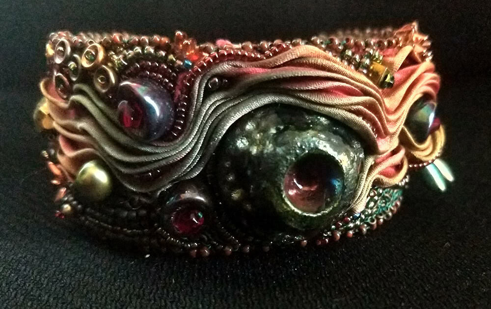 Ann Recotta "Eruption" (View B) 1.5" wide cuff with bead embroidery and bead weaving $200.