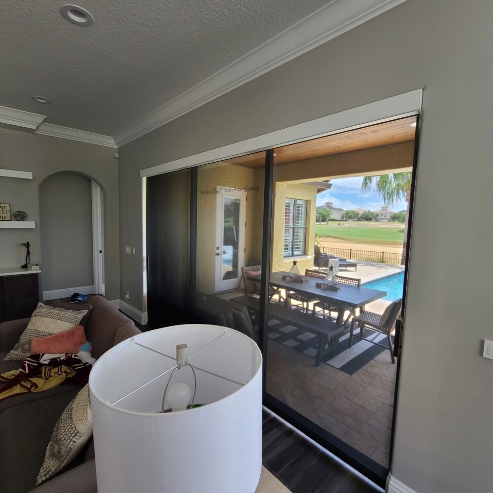 Roller Shade in a solar screen on a sliding glass door