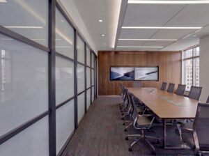 Conference room with segmented glass panels and integrated technology in demountable wall | Transwall FLEXX