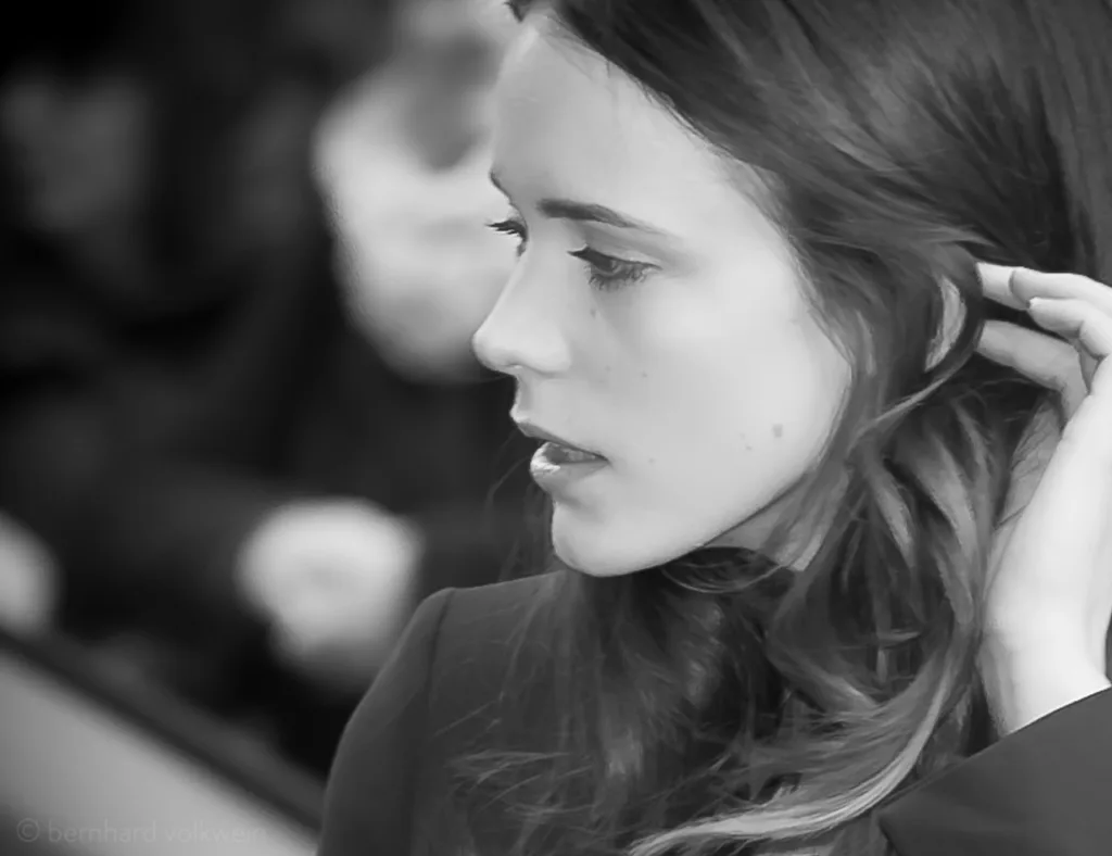 Intimate black and white close-up of Stacy Martin at Berlinale, capturing vulnerability and grace – artistic portrait from 'The Unseen Scene'.