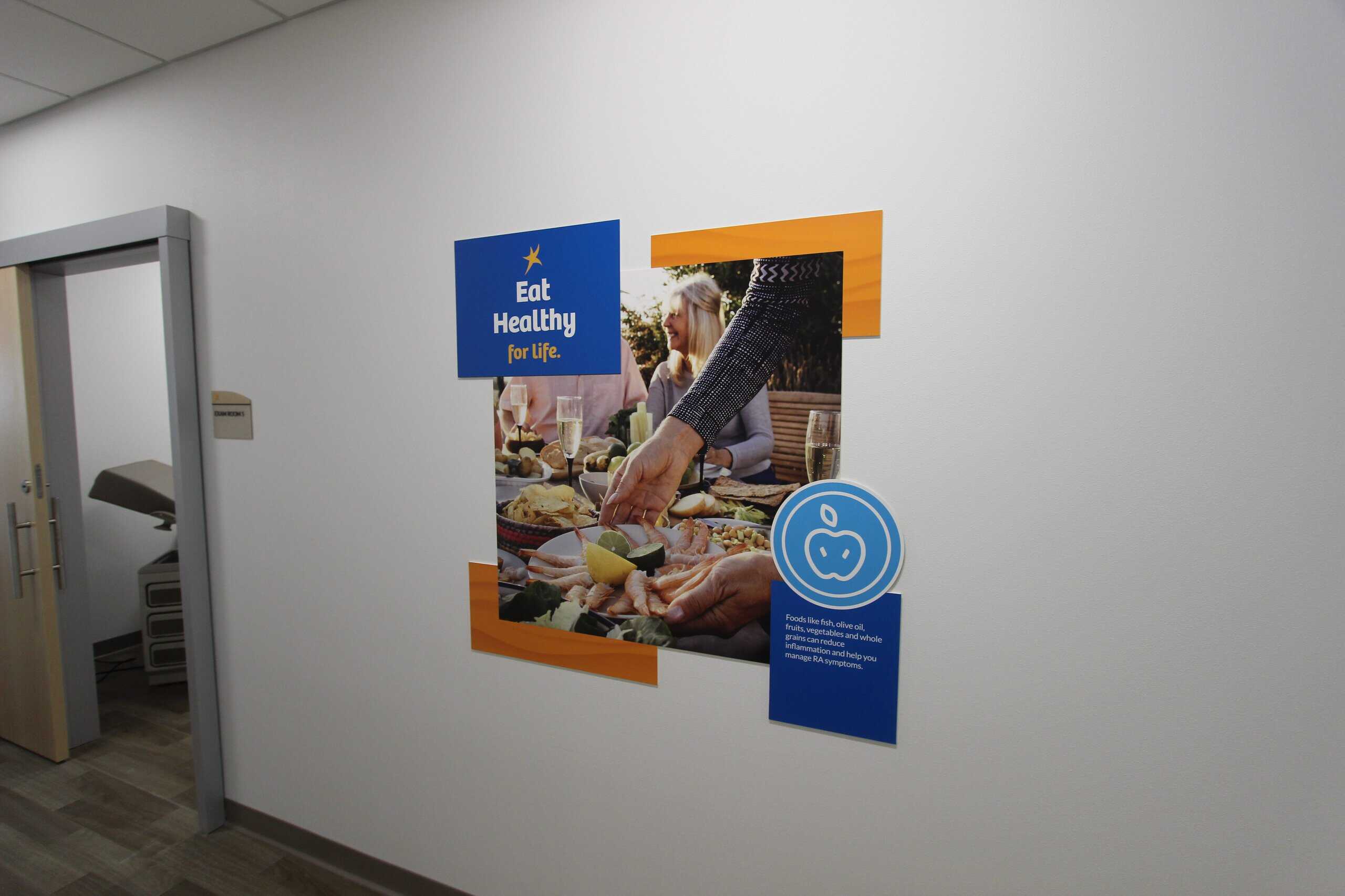 Creatively designed rigid poster for a healthcare clinic that allows for easily changeable messaging.