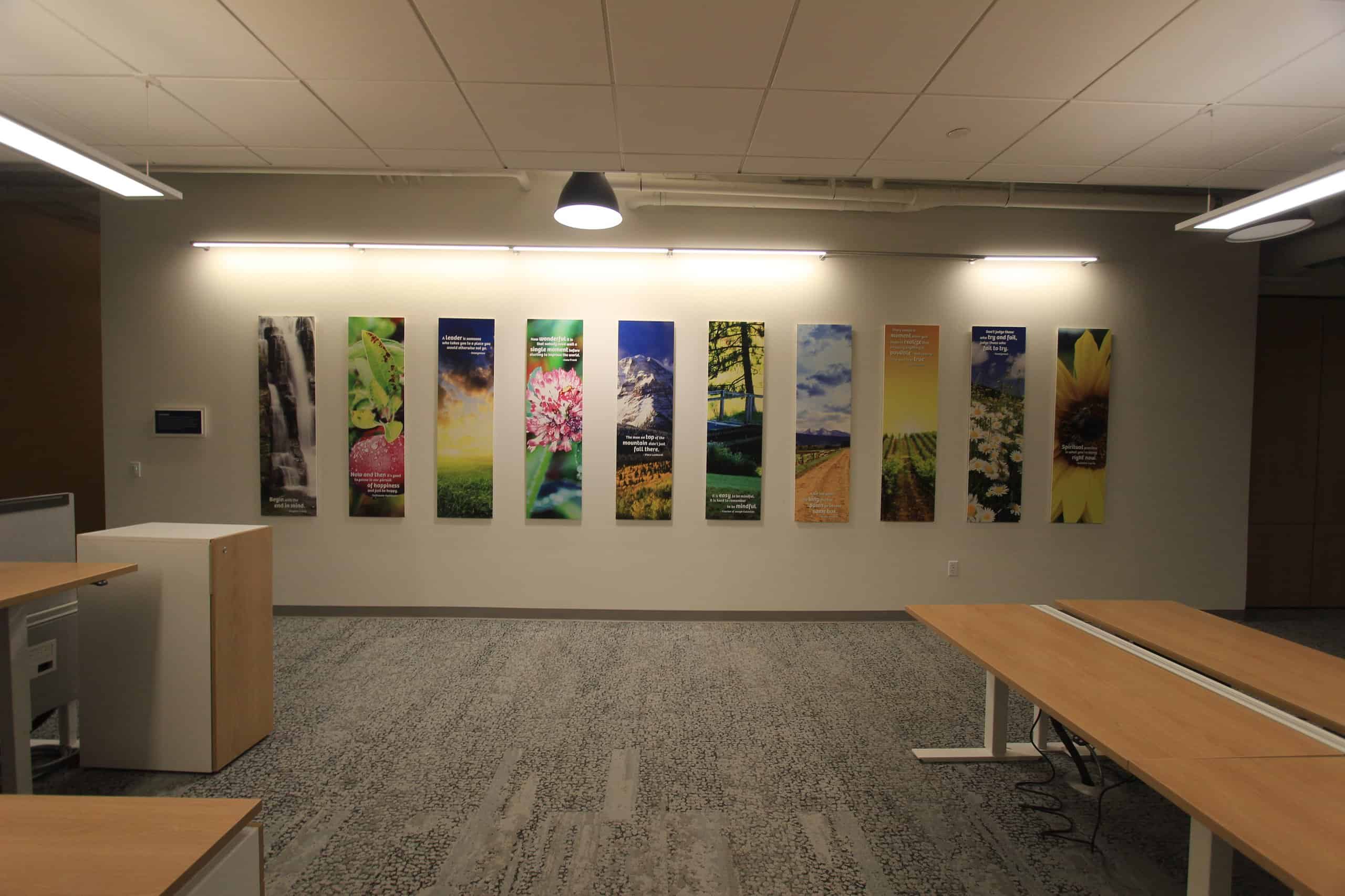 Vibrant scenic posters adorning the office wall add color and excitement.