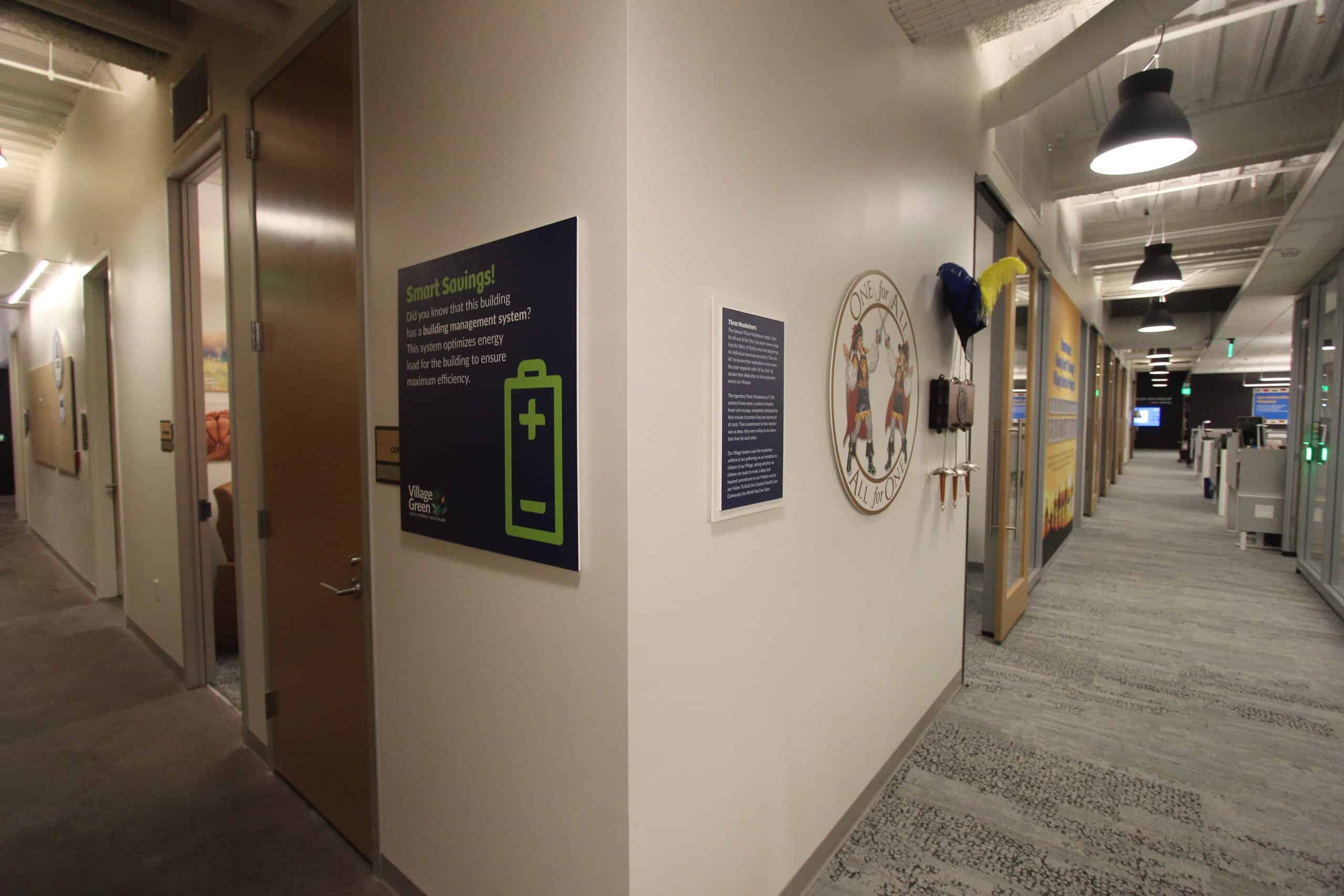 A sign displayed on a wall that informs readers about the smart savings achieved with the building management system.