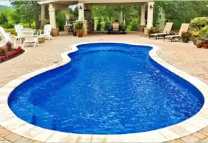 in Ground Pool with Surrounding Chairs and Pergola