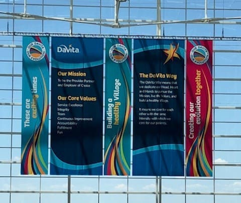 Hanging banners in the hotel atrium to brand the company’s leadership meeting.