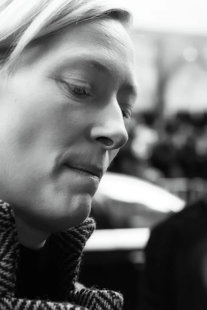 Intimate black and white close-up of Tilda Swinton at Berlinale 2014 – contemplative portrait from the exhibition 'The Unseen Scene'.